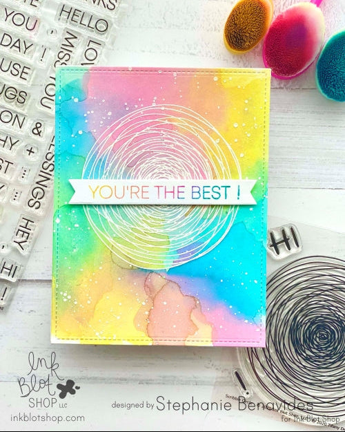 Colorful card with 'You're the Best!' message on a white surface with crafting tools.