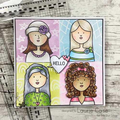 Colorful card with four illustrated girls and a 'HELLO' heart on a wooden surface.