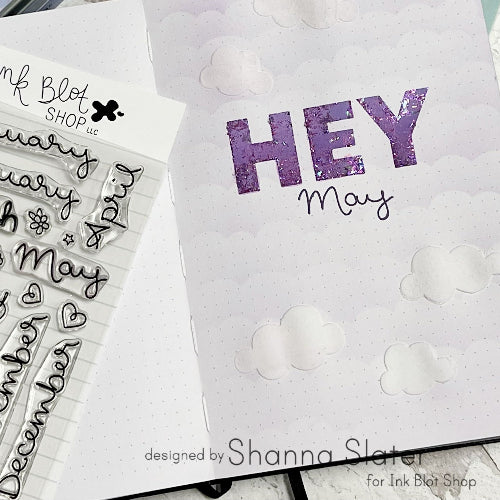 Clear stamps with months of the year and 'HEY May' text on a bullet journaling page.