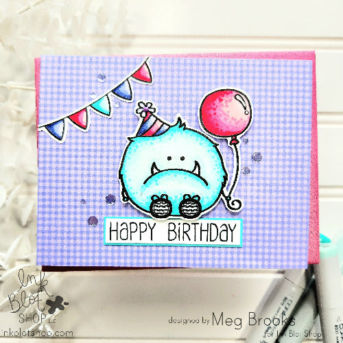 Birthday card with a cartoon monster holding a balloon on a micro gingham stamped background.